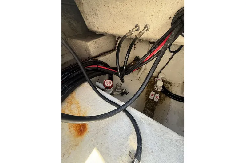 Slide: The Image of Bilge area of 2021 Custom Infusion 34 CC boat with cables and connectors. - 32