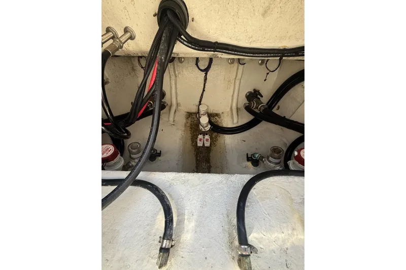 Slide: The Image of Engine compartment of 2021 Custom Infusion 34 CC with visible wiring and hoses. - 33