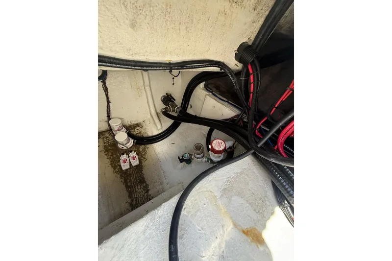 Slide: The Image of Interior view of 2021 Custom Infusion 34 CC boat wiring and plumbing system. - 34