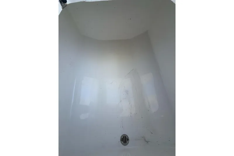 Slide: The Image of Interior view of a Custom Infusion 34 CC boat, 2021 model, showing a clean white surface. - 36