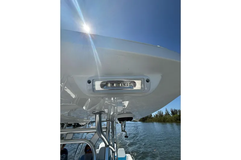 Slide: The Image of 2021 Custom Infusion 34 CC boat detail with sunlight and water backdrop. - 40