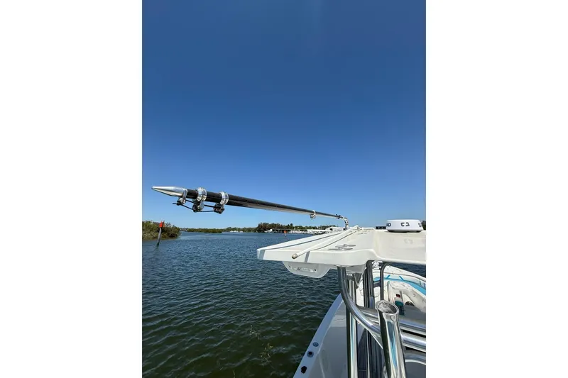 Slide: The Image of Custom Infusion 34 CC boat, 2021 model, on calm water under clear blue sky. - 45