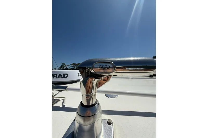 Slide: The Image of Chrome boat fitting on 2021 Custom Infusion 34 CC under clear blue sky. - 48