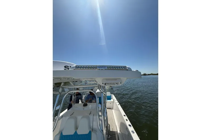 Slide: The Image of Custom Infusion 34 CC 2021 boat on water under clear blue sky. - 50