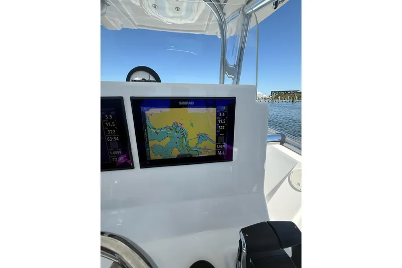 Slide: The Image of Center console of 2021 Custom Infusion 34 CC boat with navigation display. - 53