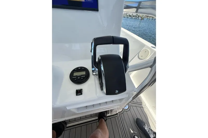 Slide: The Image of Control panel of 2021 Custom Infusion 34 CC boat with throttle and display. - 55