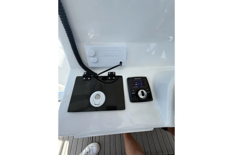 Slide: The Image of Control panel of 2021 Custom Infusion 34 CC boat with Simrad equipment. - 56