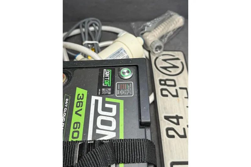 Slide: The Image of Battery and cables in a 2021 Custom Infusion 34 CC boat compartment. - 63