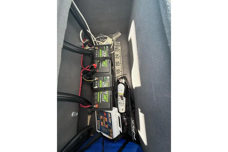 Slide: The Image of Interior view of 2021 Custom Infusion 34 CC showing battery compartment and equipment storage. - 64