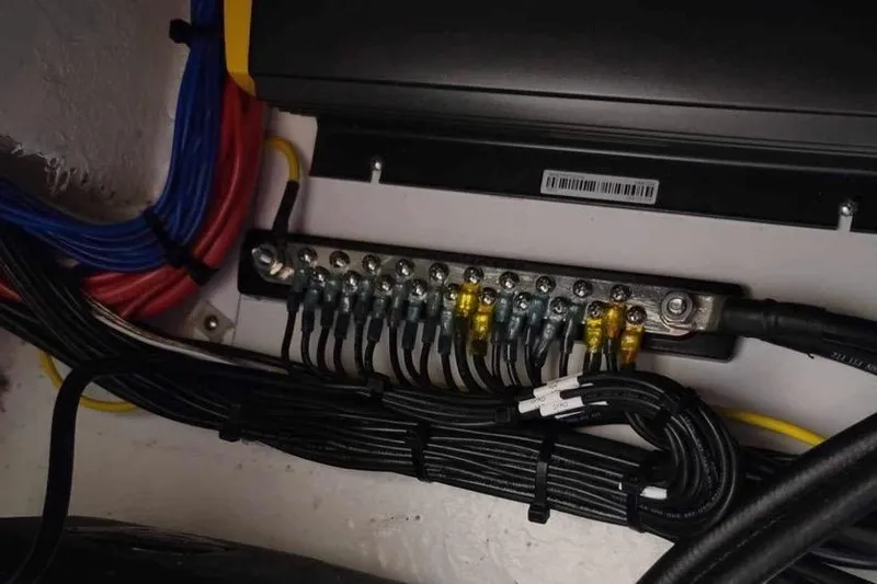 Slide: The Image of Electrical wiring and fuse panel in a 2021 Custom Infusion 34 CC boat. - 68