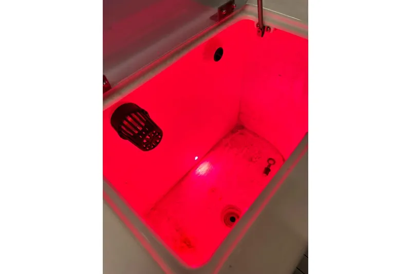 Slide: The Image of Red-lit compartment in 2021 Custom Infusion 34 CC boat. - 74