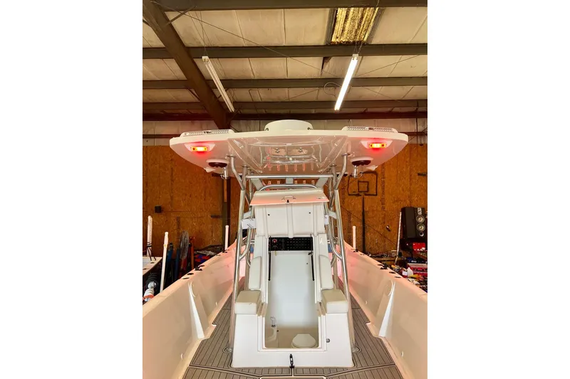 Slide: The Image of 2021 Custom Infusion 34 CC boat interior in a warehouse setting. - 77