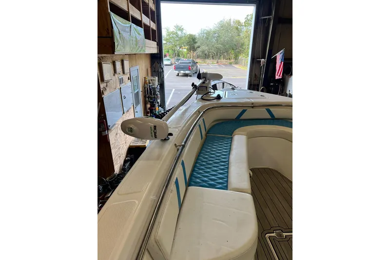 Slide: The Image of 2021 Custom Infusion 34 CC boat interior with blue seating and mounted equipment. - 80