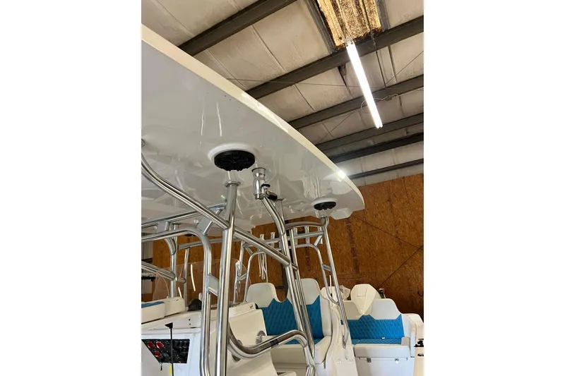 Slide: The Image of 2021 Custom Infusion 34 CC boat interior with blue seating and metal framework. - 81