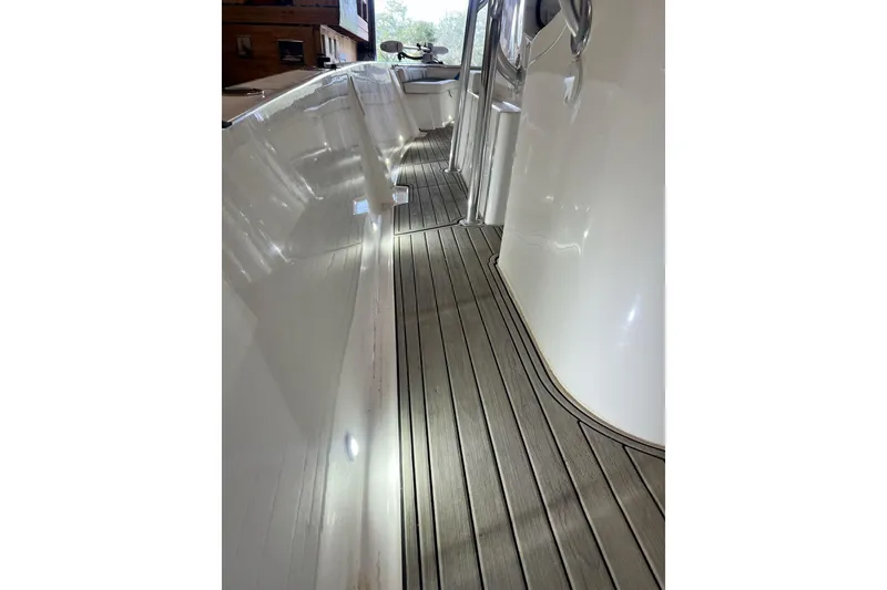 Slide: The Image of Custom Infusion 34 CC 2021 boat deck with sleek design and modern finish. - 86