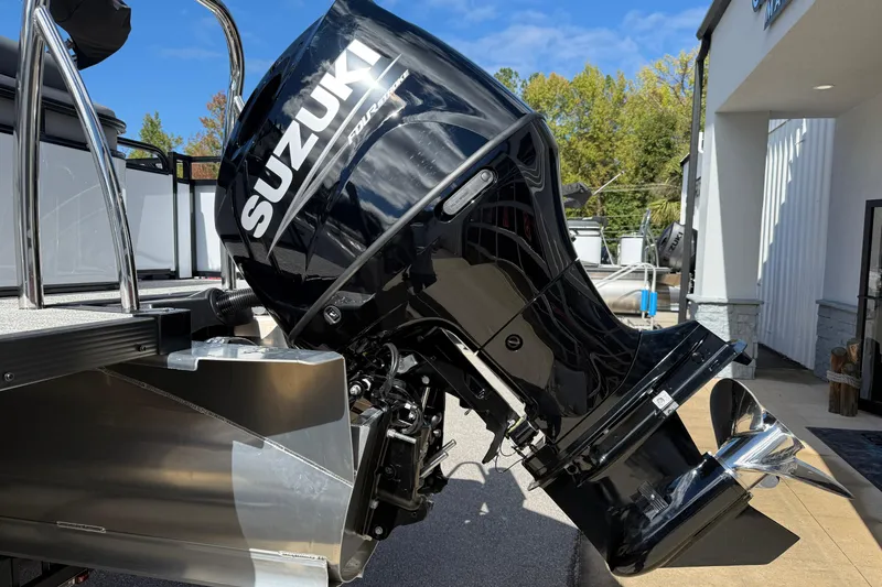 Slide: The Image of 2026 Tahoe Pontoon LTZ Versatile Rear Lounger with Suzuki outboard motor. - 6