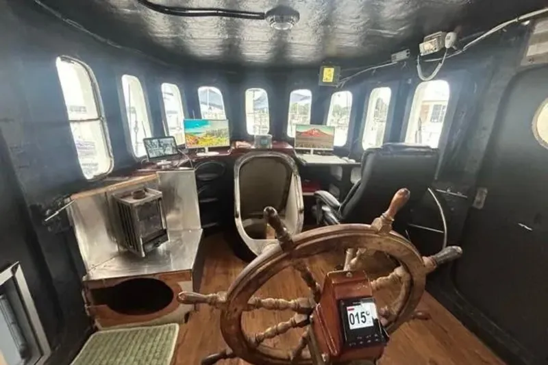 Slide: The Image of Interior of 1989 Custom Schooner Live aboard with wooden wheel and modern equipment. - 10