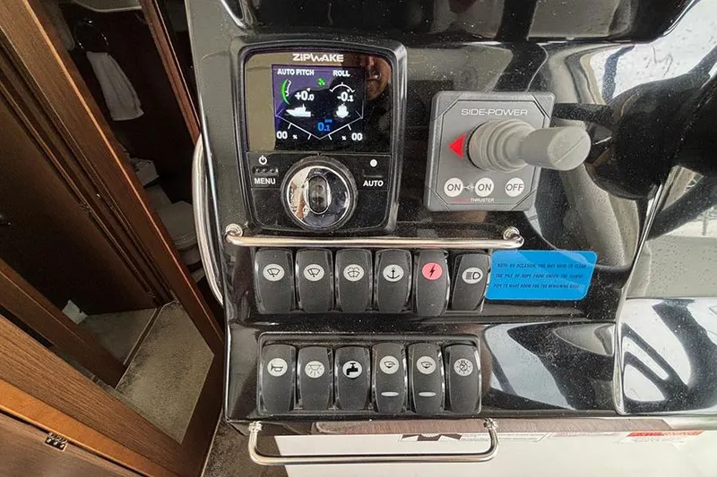 Slide: The Image of 2022 Jeanneau NC Weekender 1095 Fly docked, showcasing sleek deck design and modern features. - 11