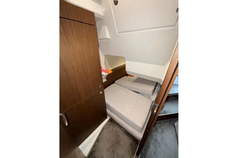 Slide: The Image of Bow view of 2022 Jeanneau NC Weekender 1095 Fly, featuring anchor and railing. - 12