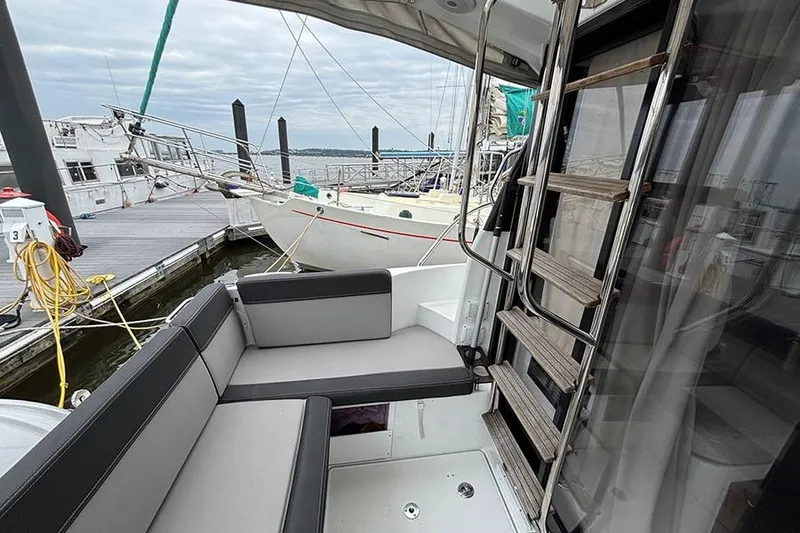 Slide: The Image of Interior of 2022 Jeanneau NC Weekender 1095 Fly, featuring cozy cabin and wooden finishes. - 36