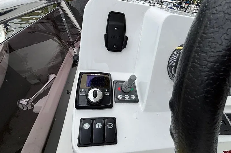 Slide: The Image of Cozy cabin bed in 2022 Jeanneau NC Weekender 1095 Fly, featuring elegant wood paneling. - 37