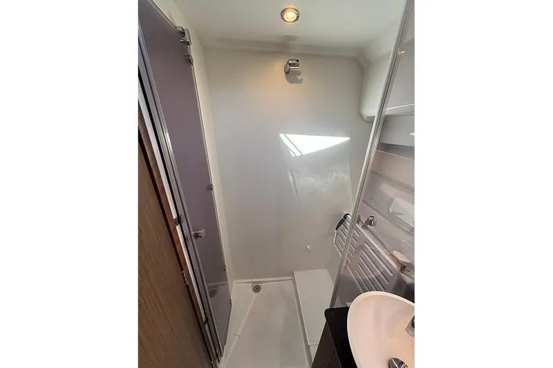 Slide: The Image of Bathroom interior of 2022 Jeanneau NC Weekender 1095 Fly boat. - 39