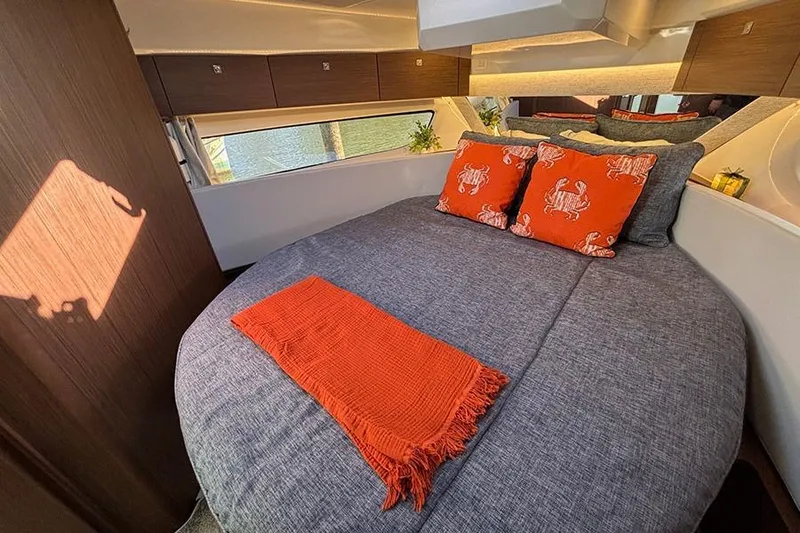 Slide: The Image of Luxurious cabin interior of 2022 Jeanneau NC Weekender 1095 Fly with cozy bedding. - 43