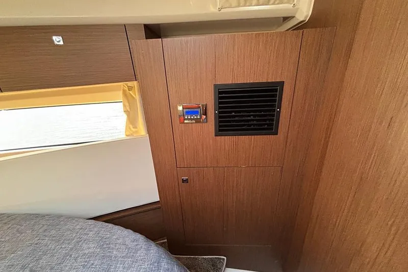 Slide: The Image of Interior of 2022 Jeanneau NC Weekender 1095 Fly with wood paneling and vent. - 44
