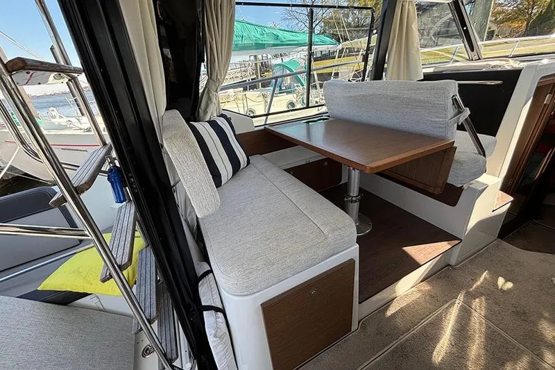 Slide: The Image of Interior of 2022 Jeanneau NC Weekender 1095 Fly with cozy seating and table. - 64