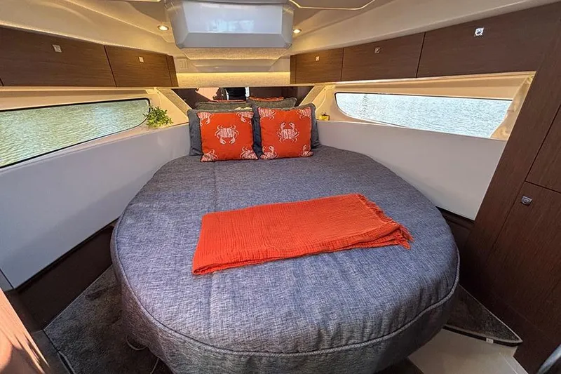 Slide: The Image of Luxurious cabin interior of 2022 Jeanneau NC Weekender 1095 Fly with cozy bedding. - 66