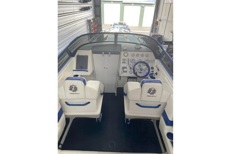 Slide: The Image of 2001 Fountain 35 Lightning boat cockpit with dual seats and control panel. - 15