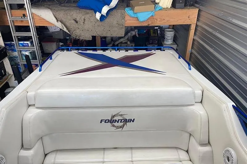 Slide: The Image of 2001 Fountain 35 Lightning boat interior with logo and colorful design. - 18