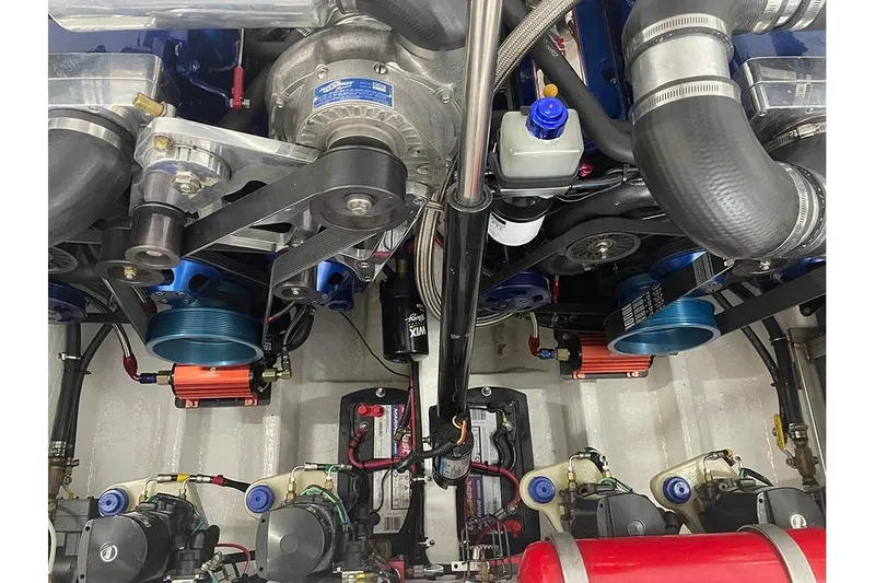 Slide: The Image of Engine compartment of a 2001 Fountain 35 Lightning boat, showcasing mechanical components and wiring. - 20