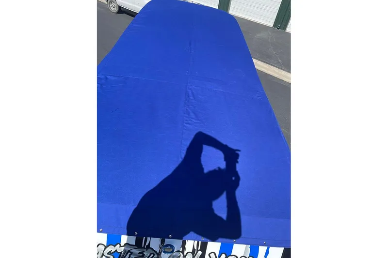 Slide: The Image of Shadow on blue cover of 2001 Fountain 35 Lightning boat. - 21