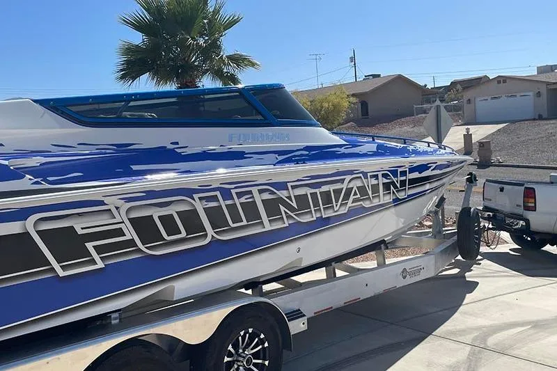Slide: The Image of 2001 Fountain 35 Lightning boat on trailer, parked in residential driveway. - 8
