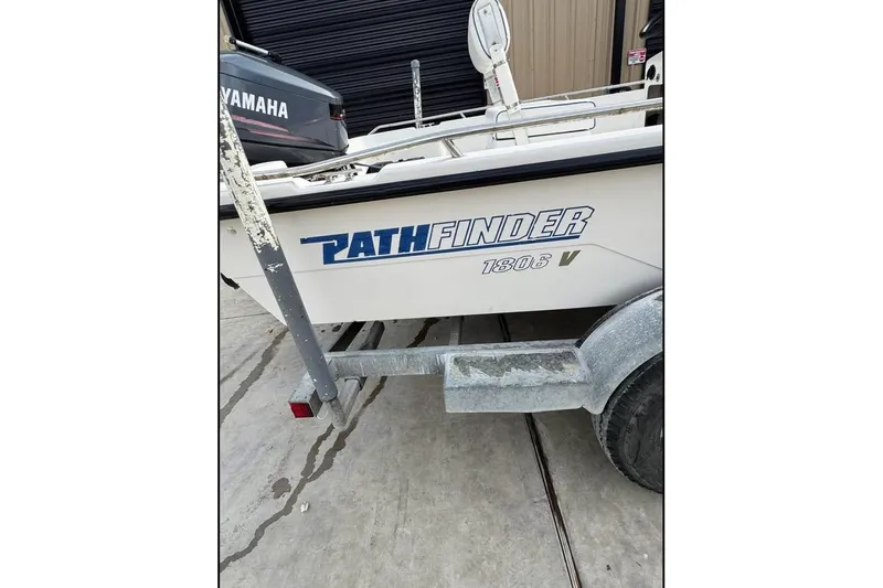 Slide: The Image of Pathfinder 1806 V boat from 2000 on trailer, Yamaha motor visible. - 14