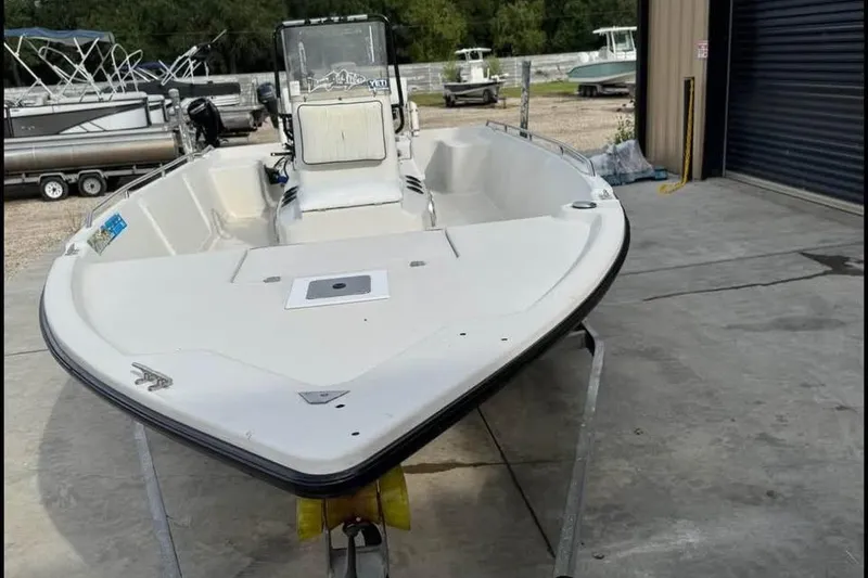 Slide: The Image of 2000 Pathfinder 1806 V boat on trailer in outdoor storage area. - 4