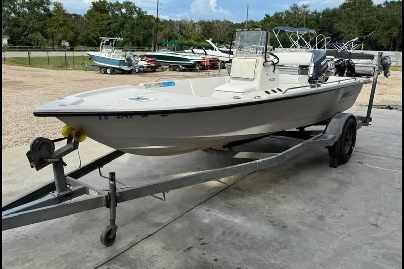 Slide: The Image of 2000 Pathfinder 1806 V boat on trailer in outdoor setting. - 7