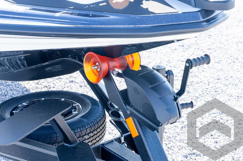 Slide: The Image of 2026 Skeeter ZXE20 boat trailer hitch with orange roller and black winch. - 10