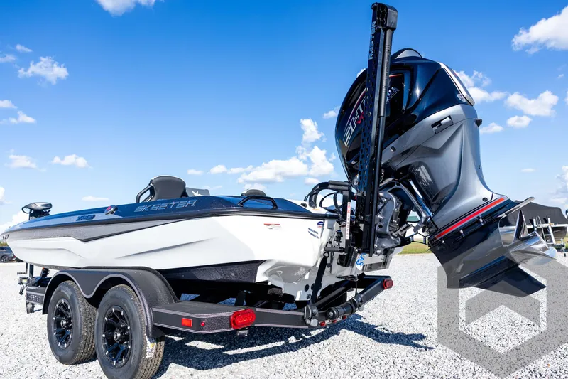 Slide: The Image of 2026 Skeeter ZXE20 boat with powerful engine on a trailer under clear blue sky. - 25