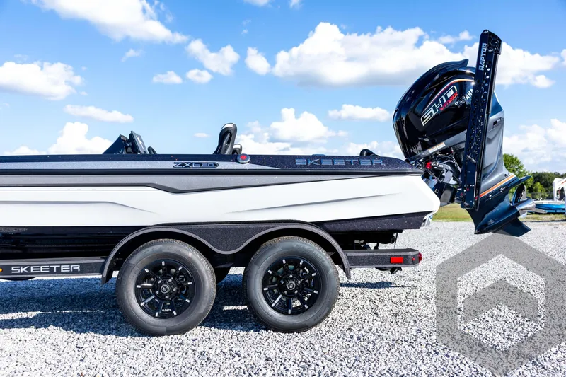 Slide: The Image of 2026 Skeeter ZXE20 boat on trailer, featuring sleek design and powerful engine. - 28