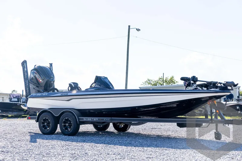 Slide: The Image of 2026 Skeeter ZXE20 boat on trailer, side view, outdoors. - 3