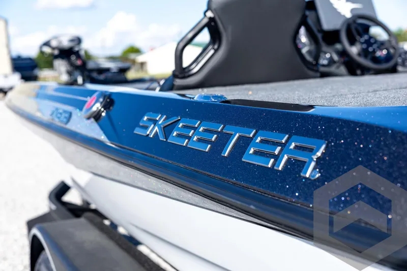 Slide: The Image of 2026 Skeeter ZXE20 boat with sleek blue design and logo detail. - 31