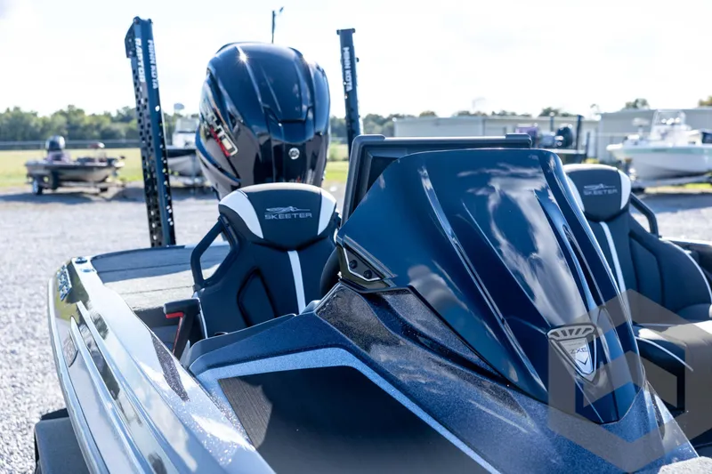 Slide: The Image of 2026 Skeeter ZXE20 boat with sleek design and modern features, parked outdoors. - 34