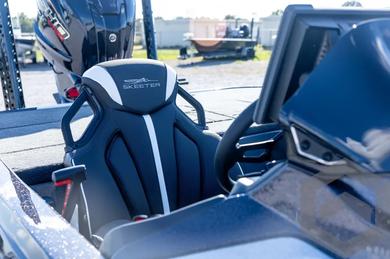 Slide: The Image of 2026 Skeeter ZXE20 boat interior with sleek seat design and modern steering console. - 35