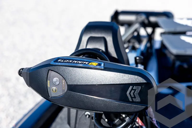 Slide: The Image of Close-up of 2026 Skeeter ZXE20 boat motor with Minn Kota branding. - 42