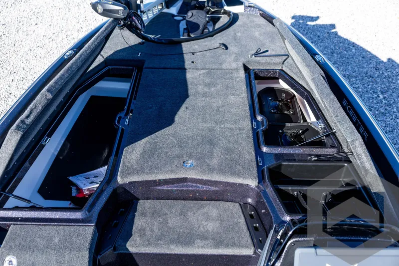Slide: The Image of 2026 Skeeter ZXE20 boat deck with storage compartments and control panel. - 46