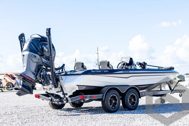 Slide: The Image of 2026 Skeeter ZXE20 boat on trailer, featuring Yamaha engine, parked on gravel lot. - 5