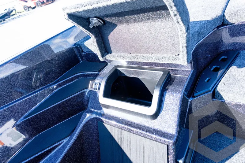 Slide: The Image of 2026 Skeeter ZXE20 boat storage compartment with open lid, showcasing interior design. - 53