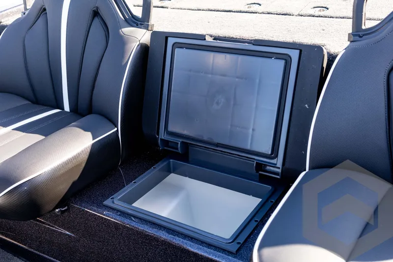 Slide: The Image of Interior of 2026 Skeeter ZXE20 boat with open storage compartment. - 56
